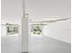 Spacious garage featuring two doors, ample space, and bright lighting, perfect for storage and vehicle parking at 7630 Sailwinds Pass, Port Richey, FL 34668