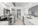 Modern kitchen features stainless appliances, sleek countertops, and an open layout to the living space at 7630 Sailwinds Pass, Port Richey, FL 34668