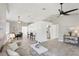 Open living area showcasing modern decor, sleek flooring, and seamless flow to dining and kitchen at 7630 Sailwinds Pass, Port Richey, FL 34668