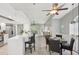 Spacious open concept with kitchen bar, dining area, and living room with great natural light at 7630 Sailwinds Pass, Port Richey, FL 34668