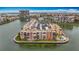 Aerial view of waterfront condo featuring stunning views of the bay and surrounding cityscape at 7665 Sun Island Dr # 206, South Pasadena, FL 33707
