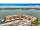 An aerial view shows a bayfront condo with parking and views at 7665 Sun Island Dr # 206, South Pasadena, FL 33707
