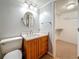 Updated bathroom with a tiled shower, granite countertops, and a new sink and a doorway to a walk-in closet at 7665 Sun Island Dr # 206, South Pasadena, FL 33707