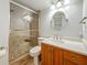 Updated bathroom with a tiled shower, granite countertops, and a new sink at 7665 Sun Island Dr # 206, South Pasadena, FL 33707
