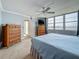 Bright bedroom featuring two dressers and a water view from the large window at 7665 Sun Island Dr # 206, South Pasadena, FL 33707