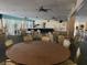 Expansive event space featuring tables, chairs, a stage, and elegant decor perfect for various gatherings at 7665 Sun Island Dr # 206, South Pasadena, FL 33707