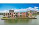 Waterfront condo complex features balconies, lush landscaping, and desirable waterfront living at 7665 Sun Island Dr # 206, South Pasadena, FL 33707
