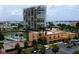 Condo building with tennis court and boat dock, offering waterfront living and recreational amenities at 7665 Sun Island Dr # 206, South Pasadena, FL 33707