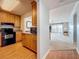 Galley kitchen with wood cabinets at 7665 Sun Island Dr # 206, South Pasadena, FL 33707