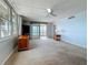 A bright living room boasting a ceiling fan, water views, and plenty of natural light at 7665 Sun Island Dr # 206, South Pasadena, FL 33707