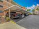Covered parking spaces offer shade and protection for vehicles in this well-maintained condo community at 7665 Sun Island Dr # 206, South Pasadena, FL 33707