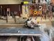 Well-organized workshop area featuring a miter saw, pegboard storage, and ample workspace for various projects at 7665 Sun Island Dr # 206, South Pasadena, FL 33707