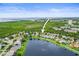 Aerial view of a residential neighborhood next to a lake with ocean views at 826 Addison Ne Dr, St Petersburg, FL 33716
