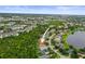 Gorgeous aerial view of a lakeside community with lush landscaping and well-maintained homes at 826 Addison Ne Dr, St Petersburg, FL 33716