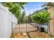 Backyard features a fenced patio with a gate leading to the pool area and mature landscaping at 826 Addison Ne Dr, St Petersburg, FL 33716