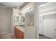 Bright bathroom boasting a walk-in closet and dual sink vanity at 826 Addison Ne Dr, St Petersburg, FL 33716