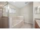 Bathroom featuring a luxurious soaking tub and ample natural light from the window at 826 Addison Ne Dr, St Petersburg, FL 33716