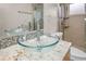 The bathroom showcases a glass vessel sink atop granite counters and a shower with a glass enclosure at 826 Addison Ne Dr, St Petersburg, FL 33716