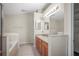 Bathroom boasting dual sinks, tub, and a separate walk-in shower for a spa-like experience at 826 Addison Ne Dr, St Petersburg, FL 33716