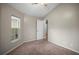 Bedroom featuring neutral walls, carpet flooring, a closet, and a window with a view at 826 Addison Ne Dr, St Petersburg, FL 33716