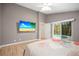 Relaxing bedroom with pool access and large television at 826 Addison Ne Dr, St Petersburg, FL 33716