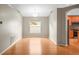Dining area features hardwood floors, neutral paint, and a bright open space adjacent to the kitchen at 826 Addison Ne Dr, St Petersburg, FL 33716