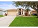 Charming single-Gathering home with a well-manicured lawn and inviting front entrance at 826 Addison Ne Dr, St Petersburg, FL 33716