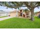 Charming single-Gathering home with lush green lawn and mature landscaping at 826 Addison Ne Dr, St Petersburg, FL 33716