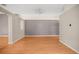 Spacious living room featuring light wood floors and neutral gray accent wall at 826 Addison Ne Dr, St Petersburg, FL 33716