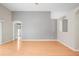 Bright living room with wood floors and open doorways at 826 Addison Ne Dr, St Petersburg, FL 33716