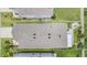 Aerial view of a well maintained roof with dark shingles on a landscaped property at 8310 Hardy Bay Loop, Wesley Chapel, FL 33545