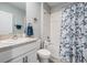 Well-lit bathroom with a shower-tub combination and modern vanity at 8310 Hardy Bay Loop, Wesley Chapel, FL 33545