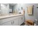 Bathroom with double sinks, granite countertops, and modern fixtures at 8310 Hardy Bay Loop, Wesley Chapel, FL 33545