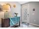 Inviting entryway with decorative accents and a stylish front door with geometric design at 8310 Hardy Bay Loop, Wesley Chapel, FL 33545