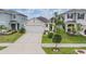 Charming home featuring a manicured front yard and a two-car garage at 8310 Hardy Bay Loop, Wesley Chapel, FL 33545