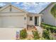 Charming one-story home with a well-maintained lawn and a welcoming front porch at 8310 Hardy Bay Loop, Wesley Chapel, FL 33545