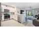 Open kitchen featuring stainless appliances, breakfast bar, and easy access to the living area at 8310 Hardy Bay Loop, Wesley Chapel, FL 33545