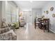 Inviting living room with natural light and a cozy seating area adjacent to the dining space at 8310 Hardy Bay Loop, Wesley Chapel, FL 33545