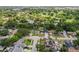 Neighborhood aerial view shows well-maintained homes surrounded by lush greenery and mature trees at 8499 101St Ave, Seminole, FL 33777