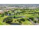 Expansive aerial shot of the golf course and surrounding commercial development with scenic ponds and greenery at 8499 101St Ave, Seminole, FL 33777