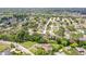 Aerial view of the property surrounded by verdant trees, located in a peaceful and established neighborhood at 8499 101St Ave, Seminole, FL 33777
