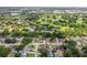 Neighborhood aerial view, blending residential homes with lush green landscapes and a picturesque golf course at 8499 101St Ave, Seminole, FL 33777