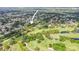 Aerial view of the property close to the golf course, showcasing lush surroundings and proximity to recreational amenities at 8499 101St Ave, Seminole, FL 33777