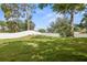 Large green backyard with healthy grass and a white privacy fence, providing a secure and serene outdoor space at 8499 101St Ave, Seminole, FL 33777