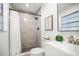 Updated bathroom with walk-in shower, modern vanity, framed mirror, and tiled floors at 8499 101St Ave, Seminole, FL 33777