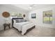 Sunny bedroom with a neutral color scheme, ceiling fan, and inviting decor at 8499 101St Ave, Seminole, FL 33777