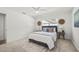 Bright bedroom with a neutral color scheme, ceiling fan and cozy decor at 8499 101St Ave, Seminole, FL 33777