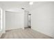 Bright bedroom with neutral carpet, closet, and connecting hallway at 8499 101St Ave, Seminole, FL 33777