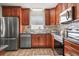 Updated kitchen with stainless steel appliances and dark wood cabinetry at 8499 101St Ave, Seminole, FL 33777