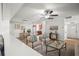 Sunlit living room with open concept, hardwood flooring, and a view of the kitchen at 8499 101St Ave, Seminole, FL 33777